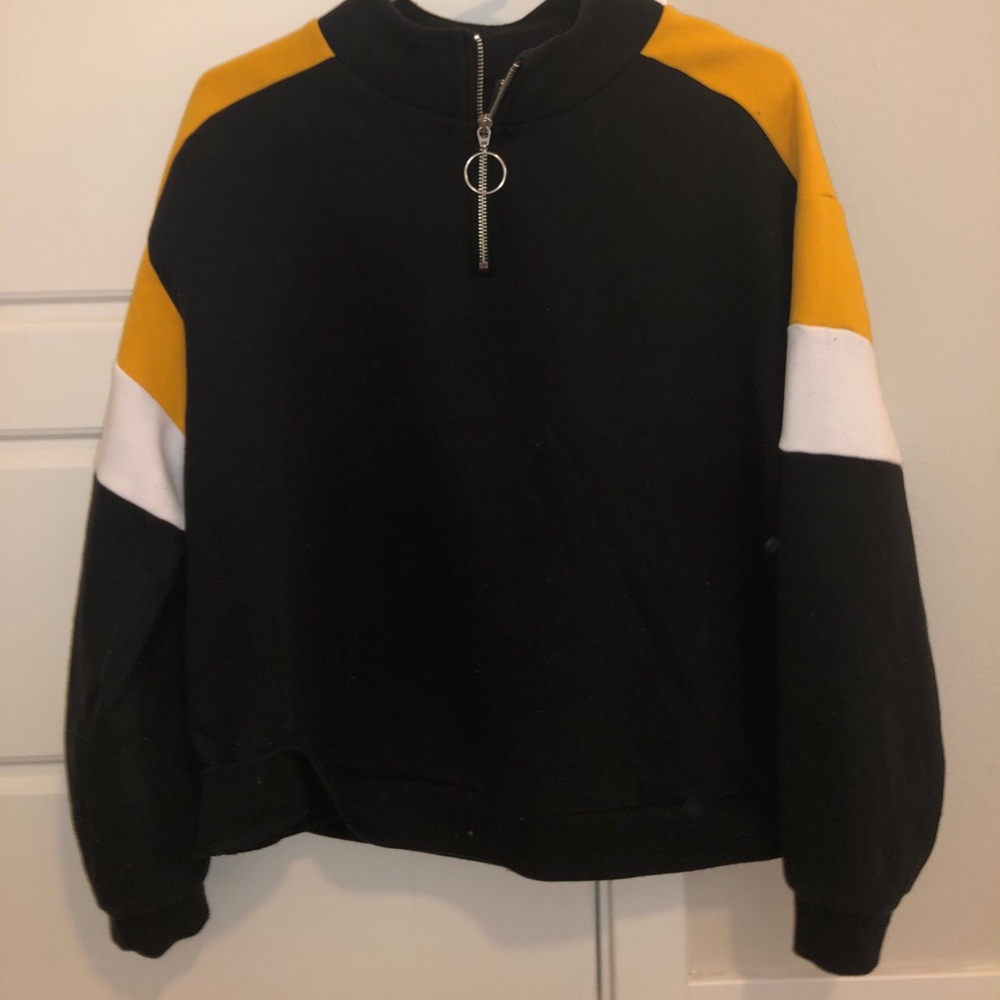 Black, white, and yellow partial zip sweatshirt